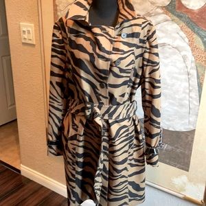 A woman’s zebra print I’ve town and black trenchcoat size 16  Taylor